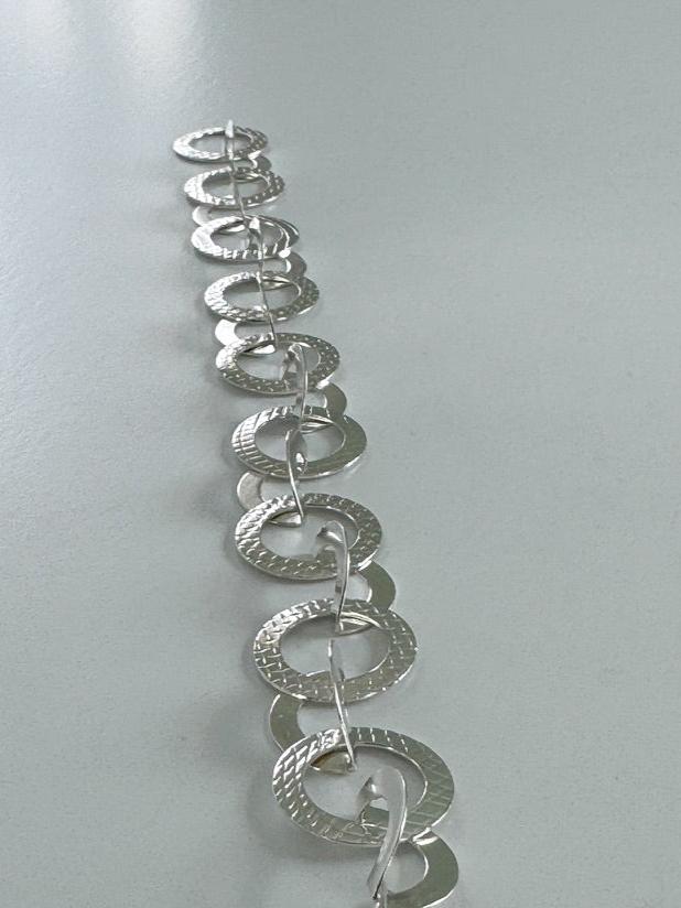 Connecting in Circles silver bracelet laid out straight-Kelli Jewelry