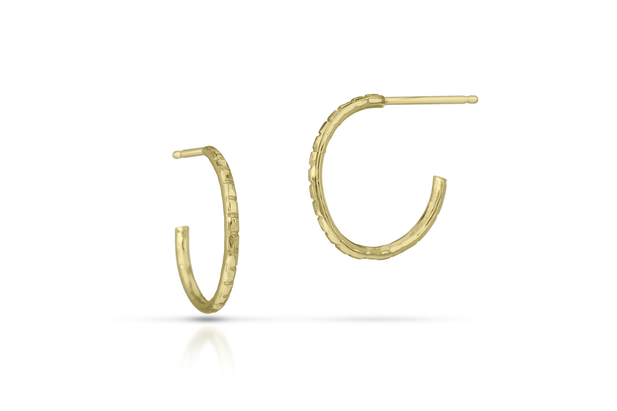 Gold hoop earrings on a white background