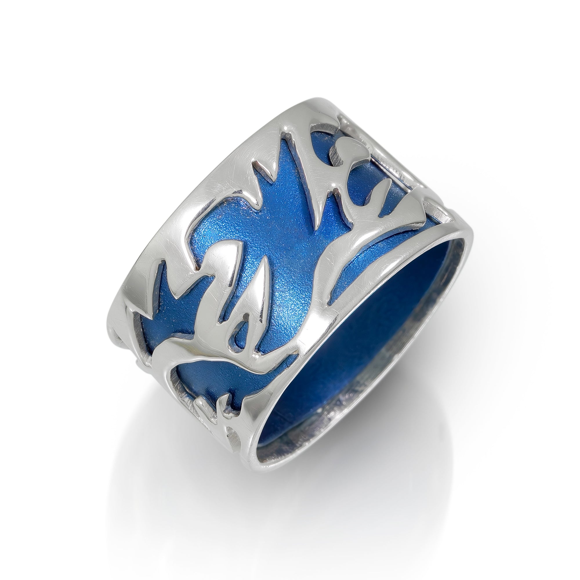 Silver Ring with Cut outs that show blue titanium band underneath on white background