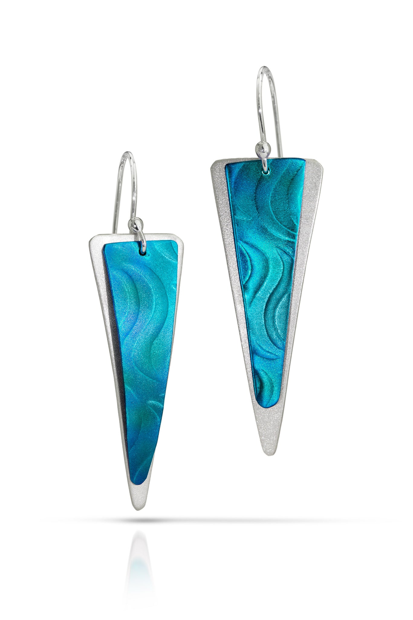 Pair of turquoise triangular earrings with silver accents on a white background