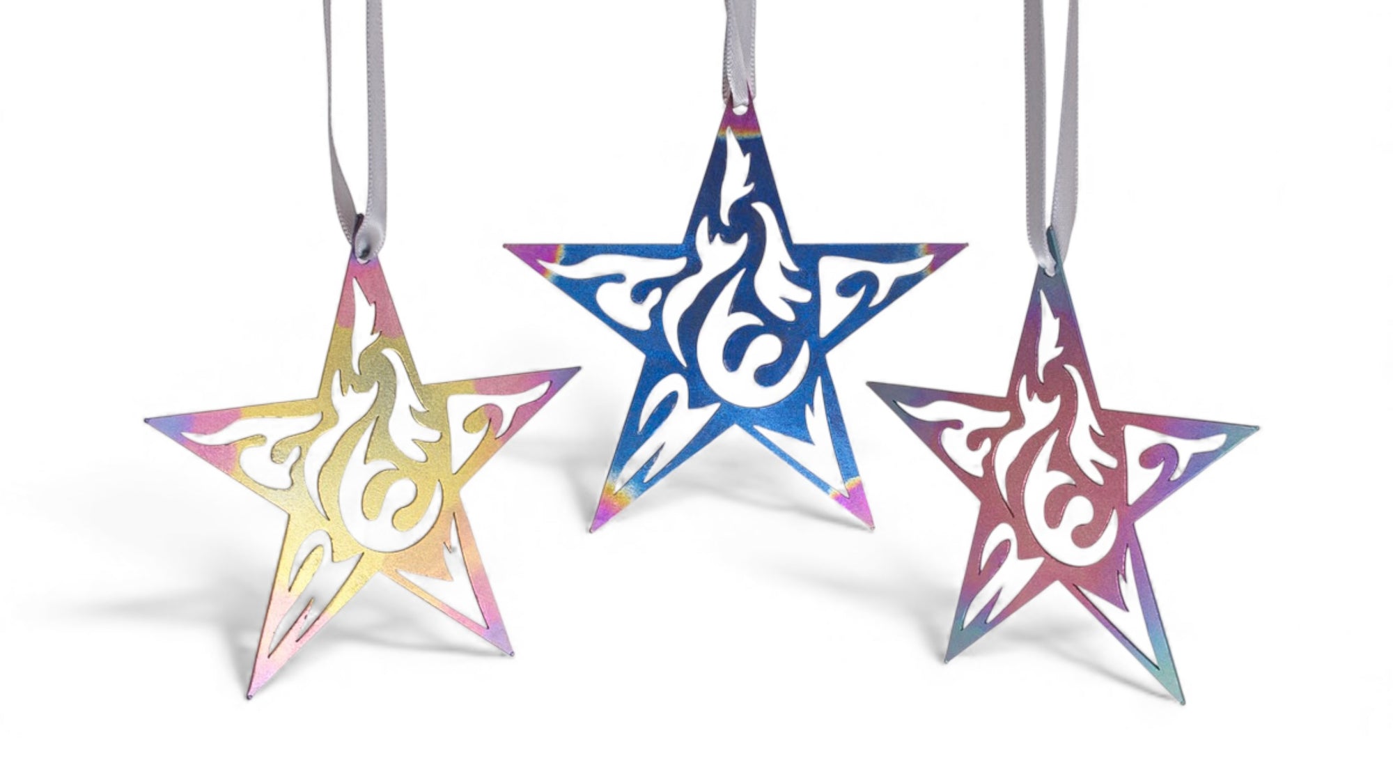 Three star-shaped decorations with intricate patterns on a white background